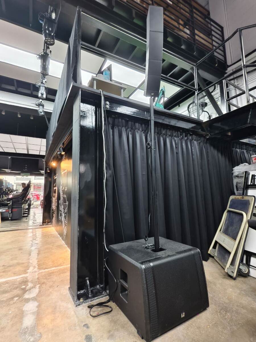 RaceRoom simulator rig backstage at a venue